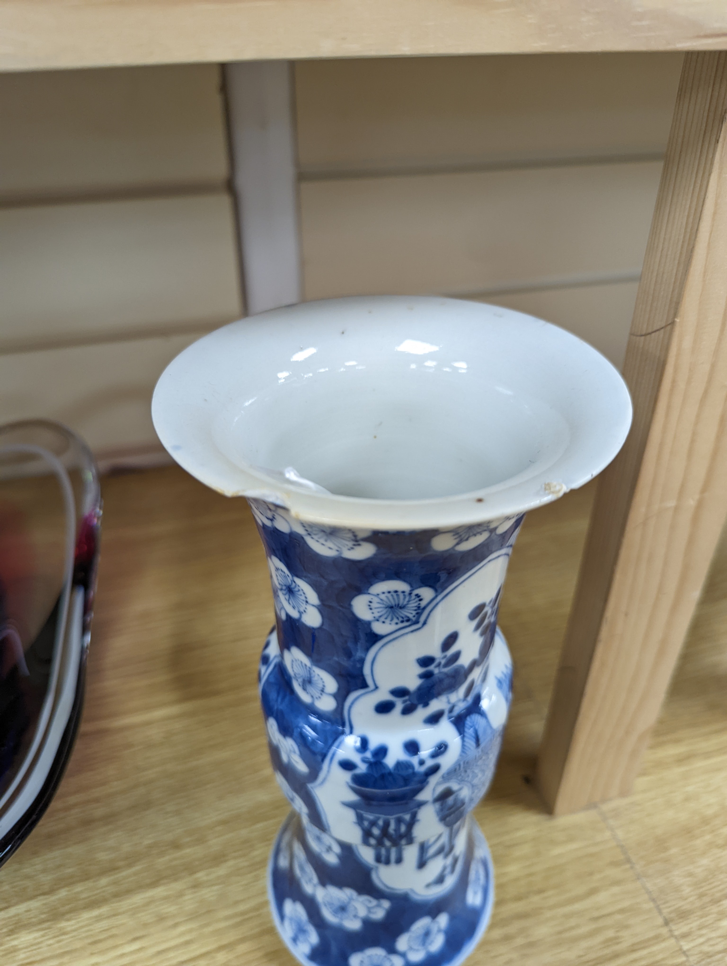 A 19th century Chinese blue and white prunus gu vase, 25 cms high.